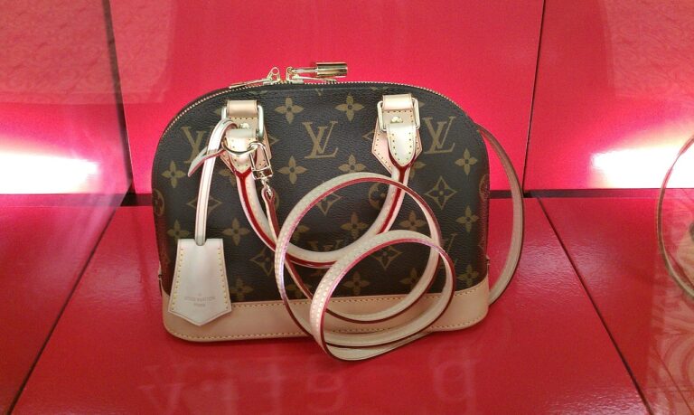 Louis Vuitton designer bag on a red background