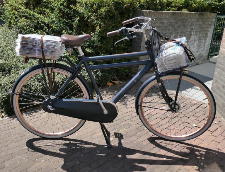 bicycle loaded up with papers for a teen on a paper round